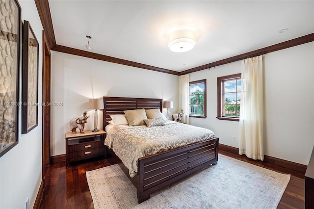 bedroom with dark hardwood / wood-style floors and ornamental molding