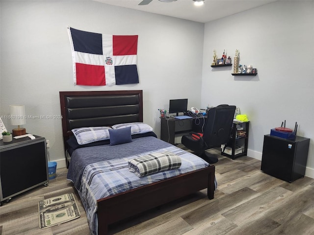 bedroom featuring hardwood / wood-style floors and ceiling fan