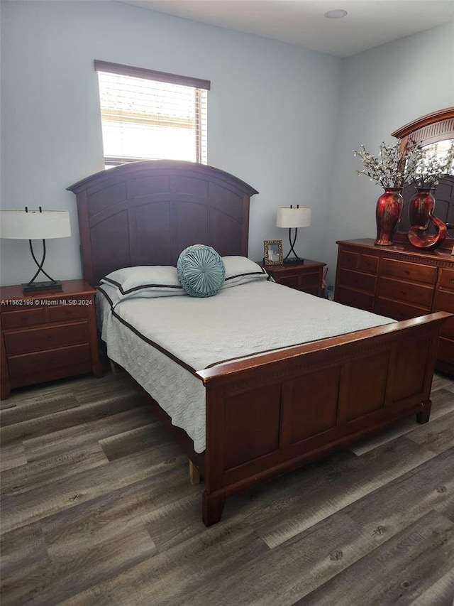 bedroom featuring dark wood-type flooring