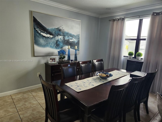 dining room with light tile floors and crown molding