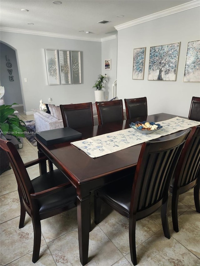 tiled dining space with crown molding