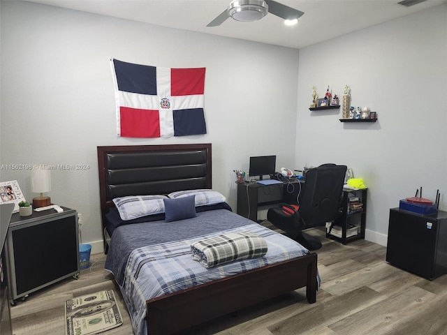 bedroom featuring wood-type flooring and ceiling fan