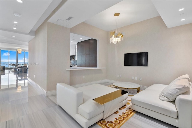 living room with a notable chandelier, floor to ceiling windows, and light tile flooring