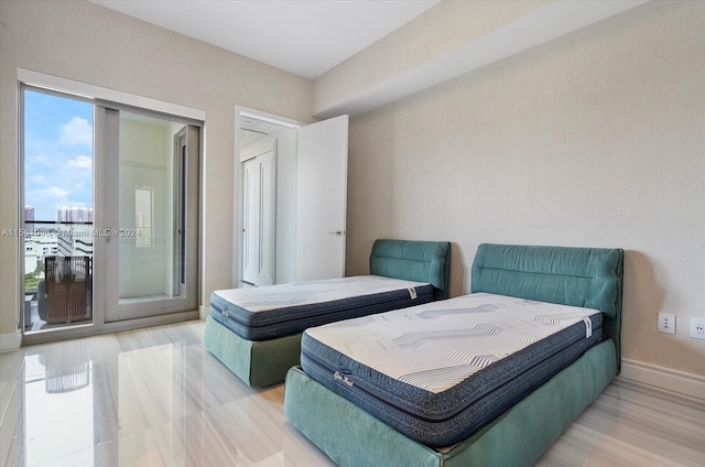 bedroom featuring access to outside and light hardwood / wood-style flooring