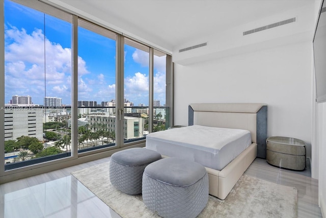 bedroom featuring expansive windows