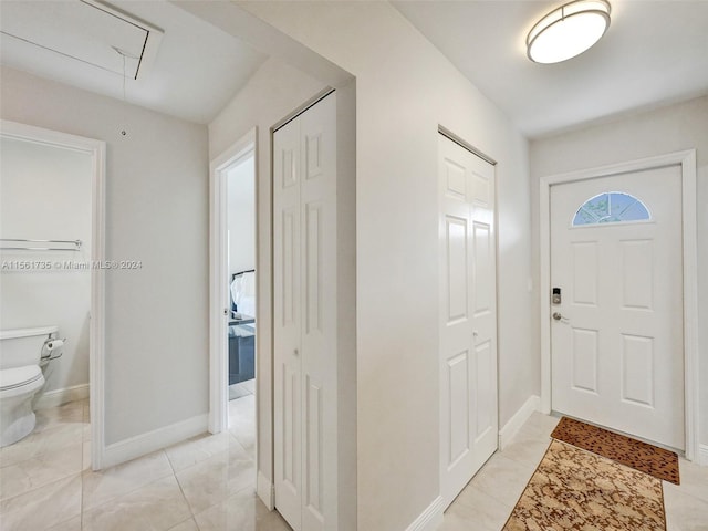 entrance foyer featuring light tile floors