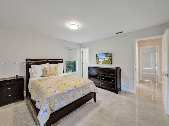 bedroom featuring light tile flooring