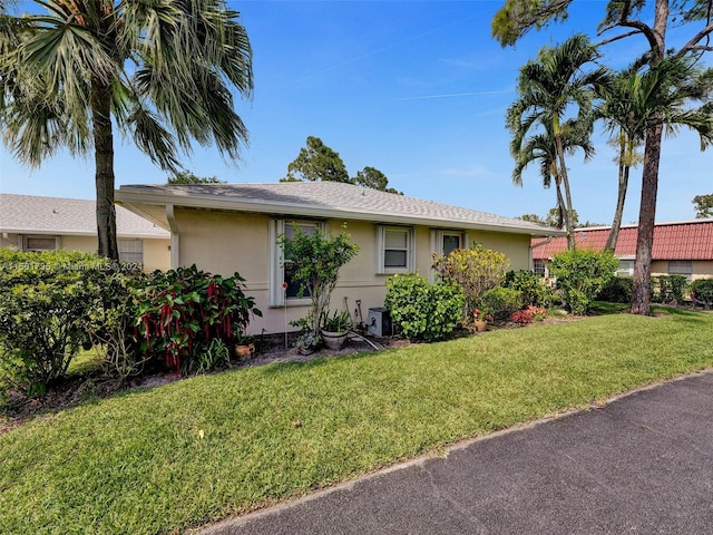 ranch-style home with a front yard