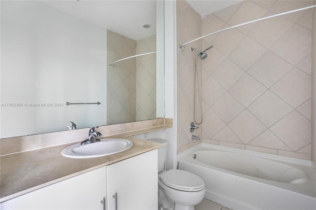 full bathroom with vanity, toilet, and tiled shower / bath