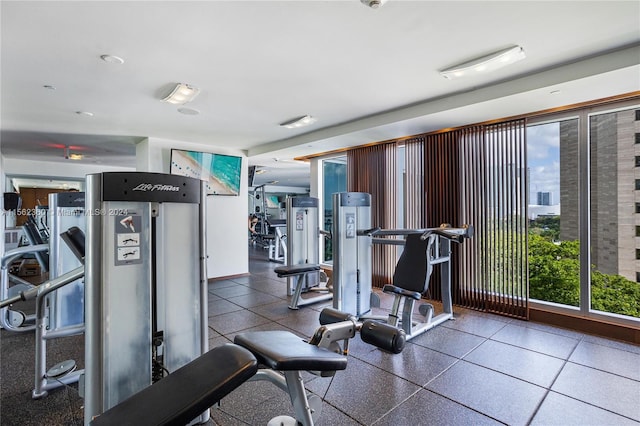 workout area with tile floors