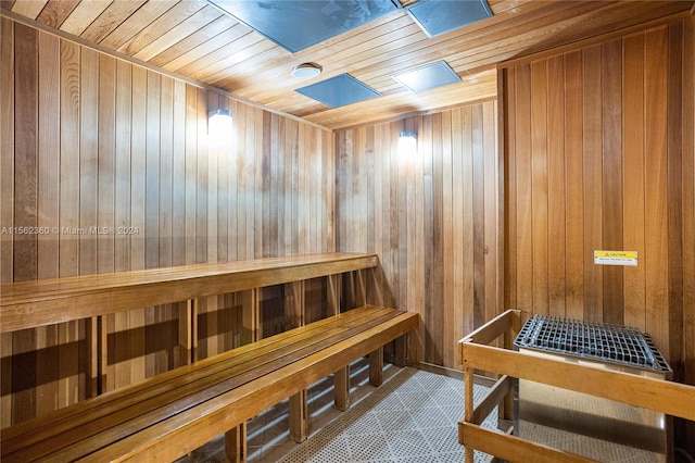 view of sauna featuring wood walls