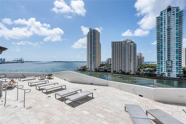 view of terrace with a water view