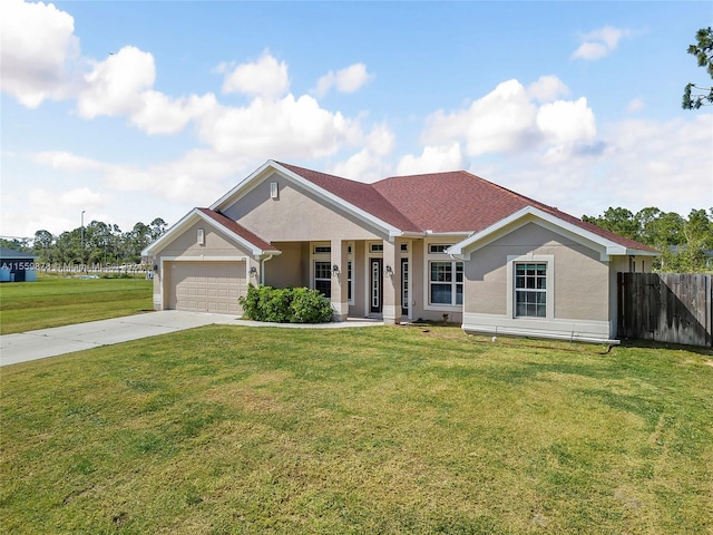 view of front of home featuring a front yard and a garage