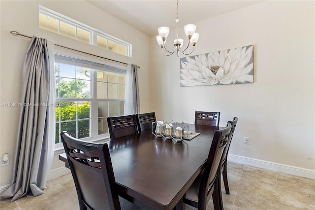 dining area with a notable chandelier and light tile floors