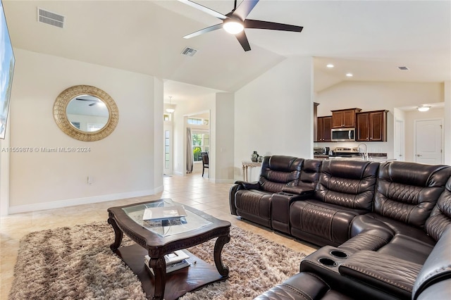 tiled living room featuring sink, ceiling fan, and lofted ceiling