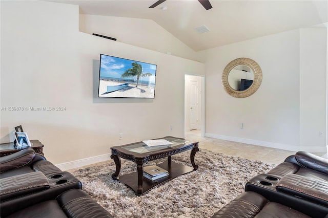 living room with light tile flooring, vaulted ceiling, and ceiling fan