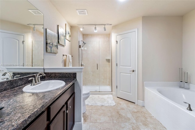 full bathroom featuring tile flooring, independent shower and bath, large vanity, a textured ceiling, and toilet