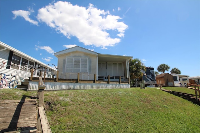 back of house with a yard