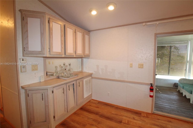 kitchen featuring light hardwood / wood-style flooring and vaulted ceiling