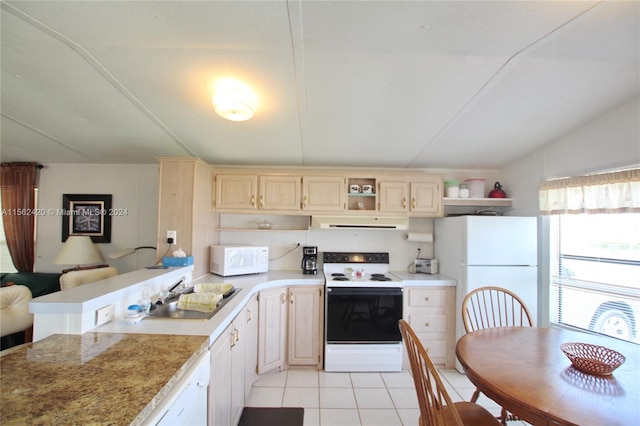 kitchen featuring sink, white appliances, light tile flooring, lofted ceiling, and kitchen peninsula