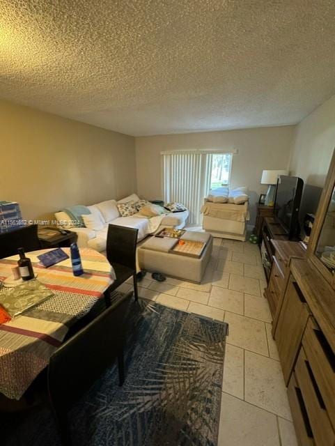 tiled living room with a textured ceiling