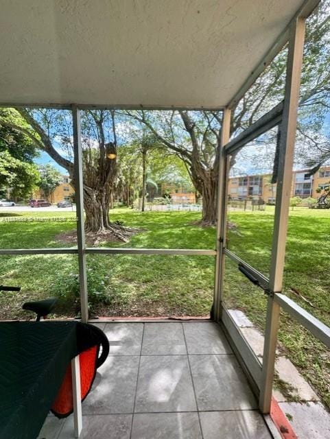 unfurnished sunroom with a healthy amount of sunlight