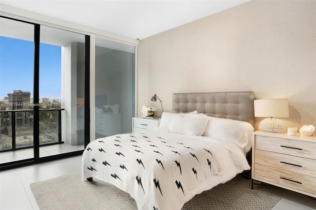 bedroom featuring floor to ceiling windows and access to outside