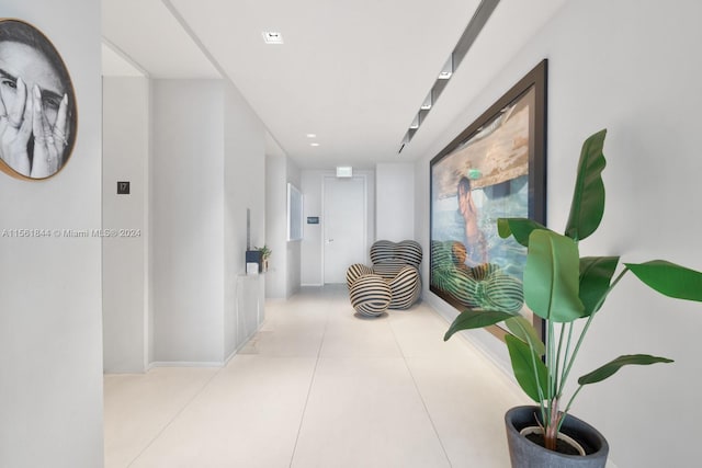 hallway featuring light tile floors