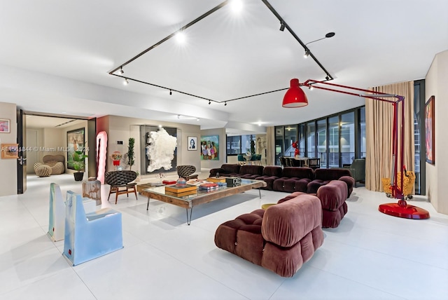 living room with light tile floors and rail lighting