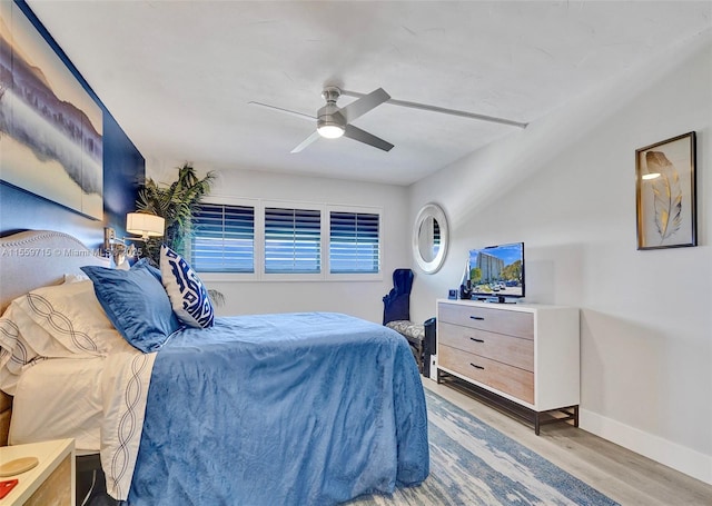 bedroom with ceiling fan and light wood-type flooring