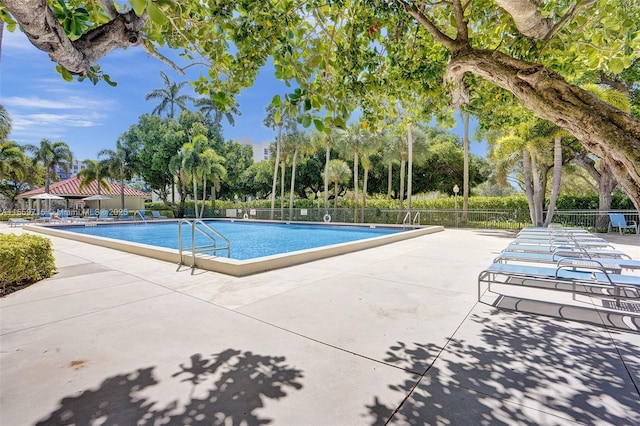 view of swimming pool with a patio