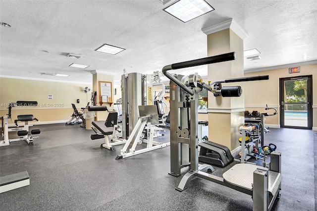 exercise room featuring a textured ceiling and ornamental molding