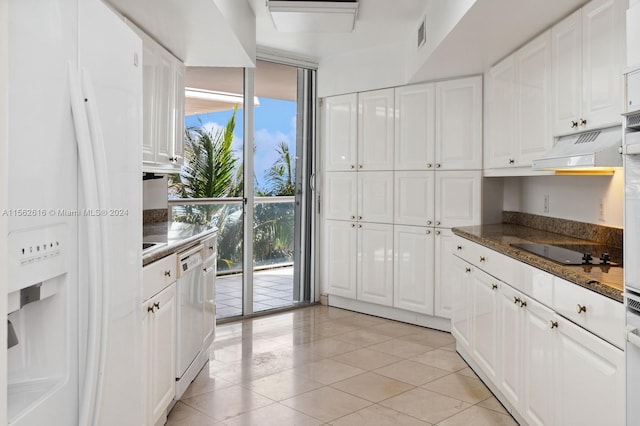 kitchen with white cabinetry, custom exhaust hood, white appliances, and a wealth of natural light