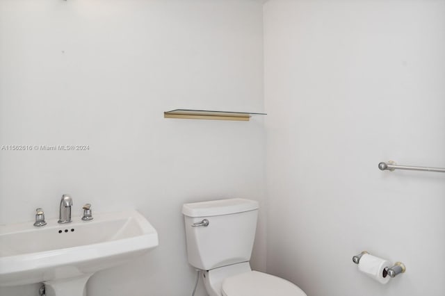 bathroom with sink and toilet