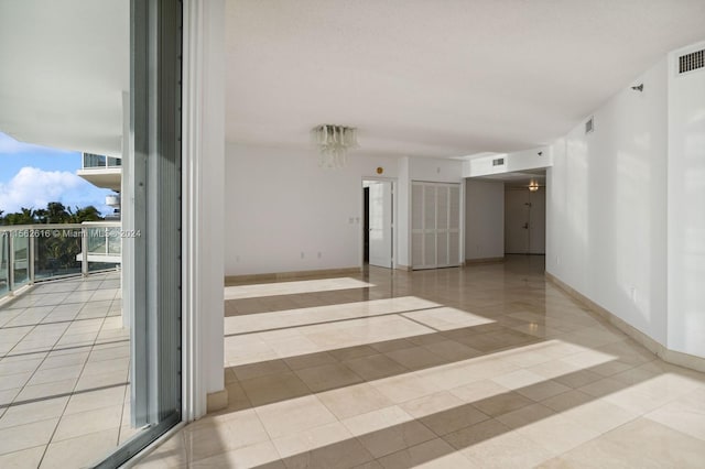 empty room with light tile patterned flooring