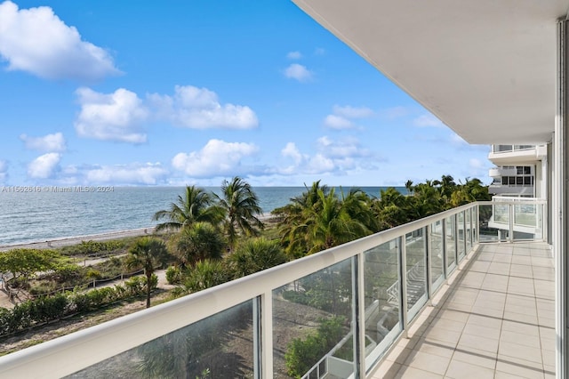 balcony featuring a water view