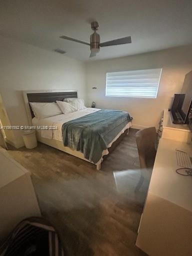 bedroom featuring ceiling fan and wood-type flooring