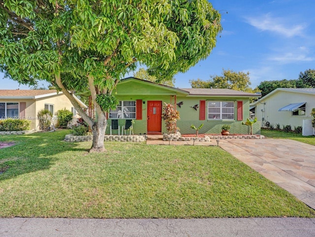 ranch-style home with a front lawn