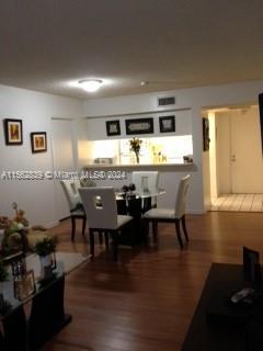 dining room with hardwood / wood-style flooring