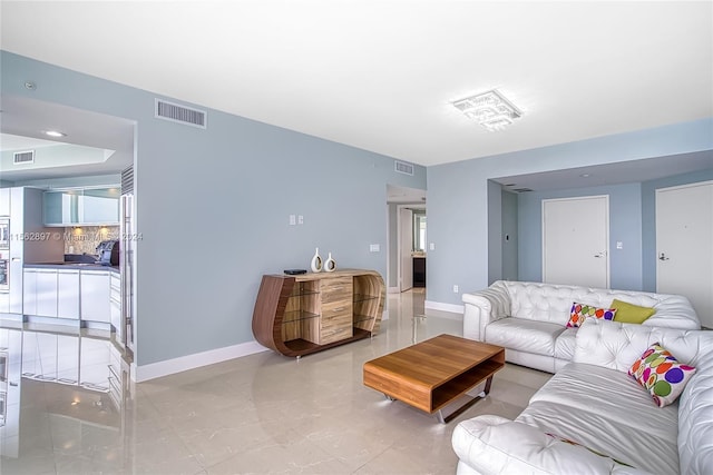 living room featuring light tile floors