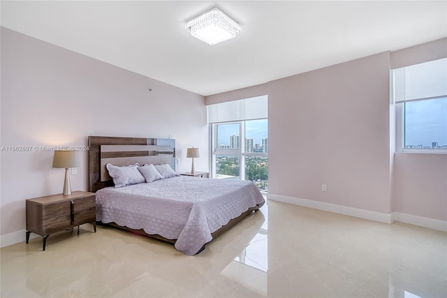 bedroom featuring light tile floors