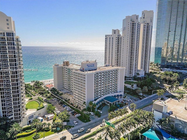 birds eye view of property featuring a view of the beach and a water view