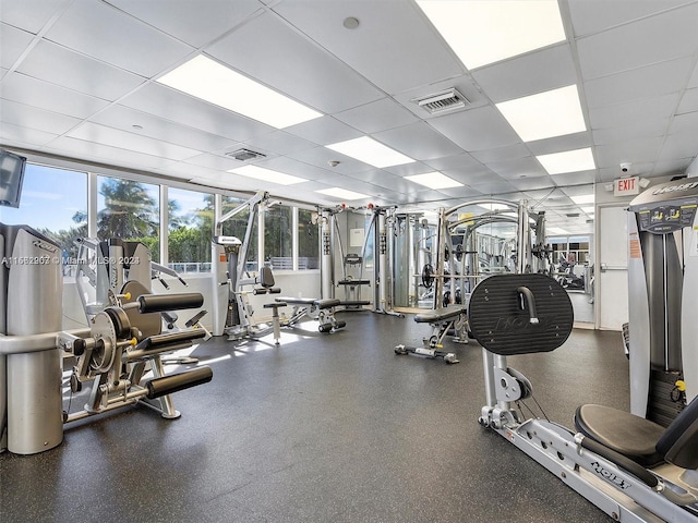 exercise room featuring a drop ceiling