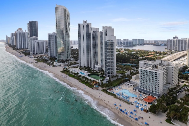 aerial view featuring a water view and a beach view