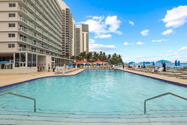 view of patio / terrace featuring a water view and a view of the beach