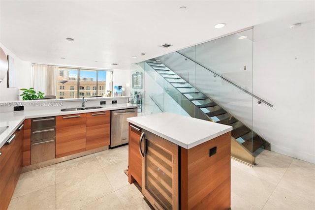 kitchen with stainless steel dishwasher, light tile floors, a kitchen island, wine cooler, and sink