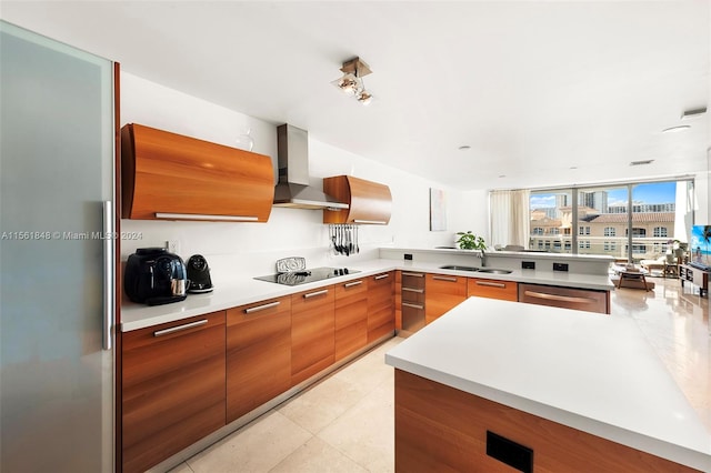 kitchen with black electric stovetop, stainless steel dishwasher, wall chimney exhaust hood, sink, and light tile flooring