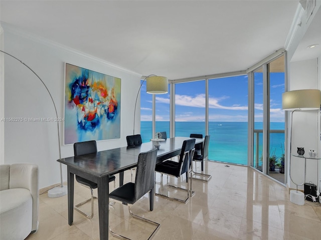 tiled dining area with expansive windows, crown molding, and a water view