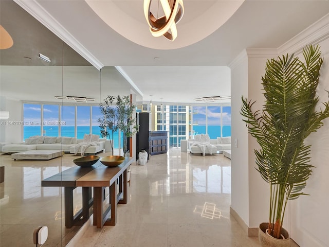 interior space with light tile flooring, expansive windows, a water view, and a wealth of natural light