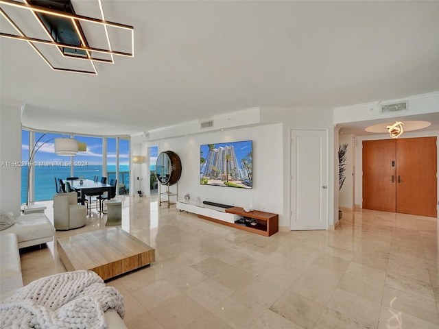 living room featuring floor to ceiling windows, a water view, ornamental molding, and light tile floors